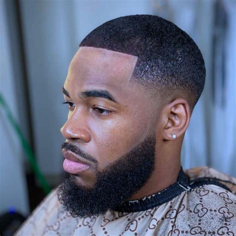 When you experience hair loss in the crown hairline area, opt for a high fade for the sides and back and a short cut for the top. . Black mens haircut fade
